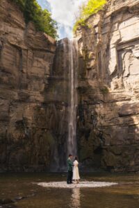 A newlywed couple that had just eloped dancing at the base of Letchworth State Park waterfall