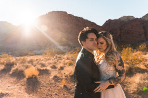 A bride and groom enjoy the sunsetting in Nevada during their elopement. 