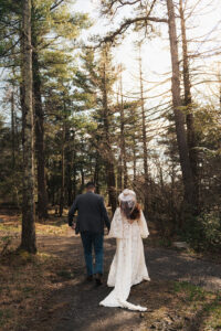 a couple eloping in the woods at Minnewaska State Park Preserve with western attire