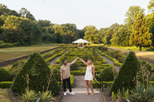 a couple dances in a garden