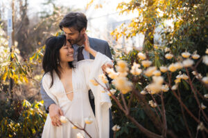 newlyweds embracing each other in a garden