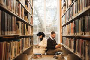 a couple reading together in a local library