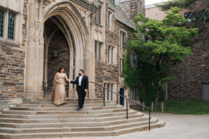 a couple walks down the steps of historical princeton new jersey