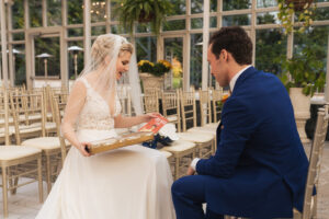 bride and groom exchanging gifts