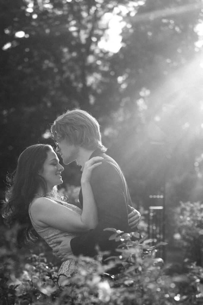 a couple taking anniversary photos in a park during summer