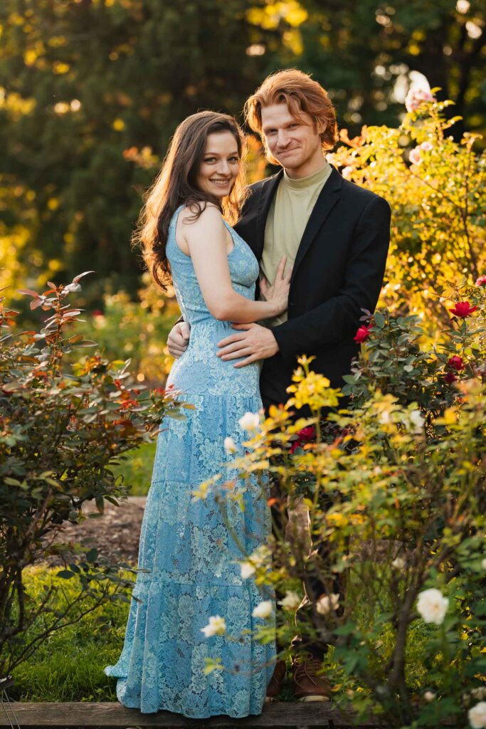 a couple taking anniversary photos in a park during summer