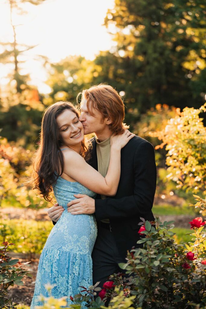 a couple taking anniversary photos in a park during summer