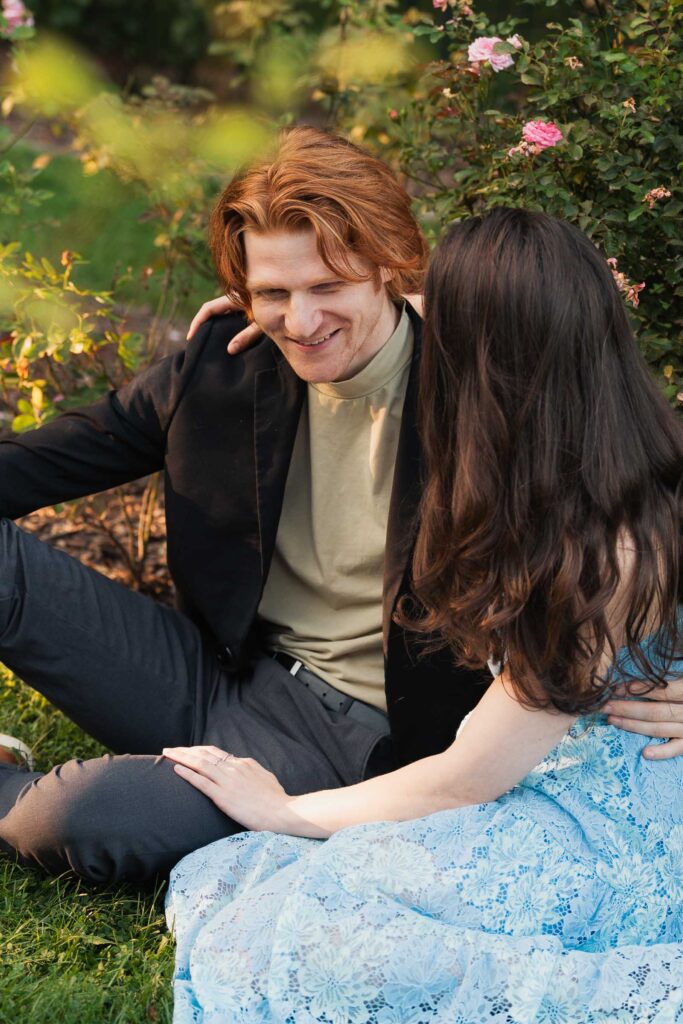 a couple taking anniversary photos in a park during summer