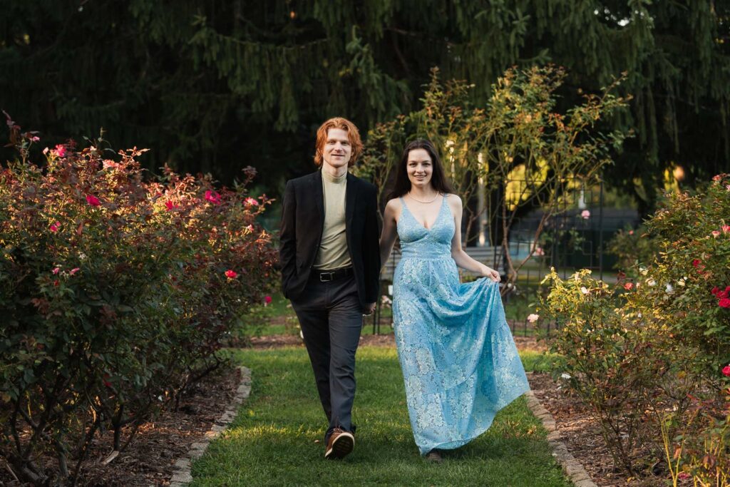 a couple taking anniversary photos in a park during summer