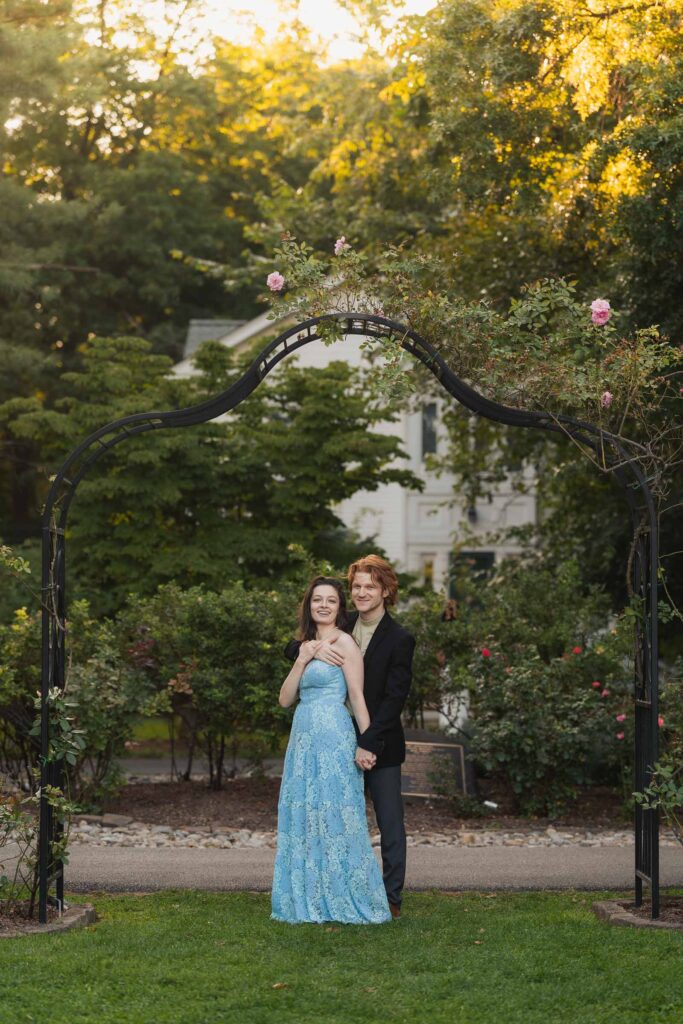 a couple taking anniversary photos in a park during summer