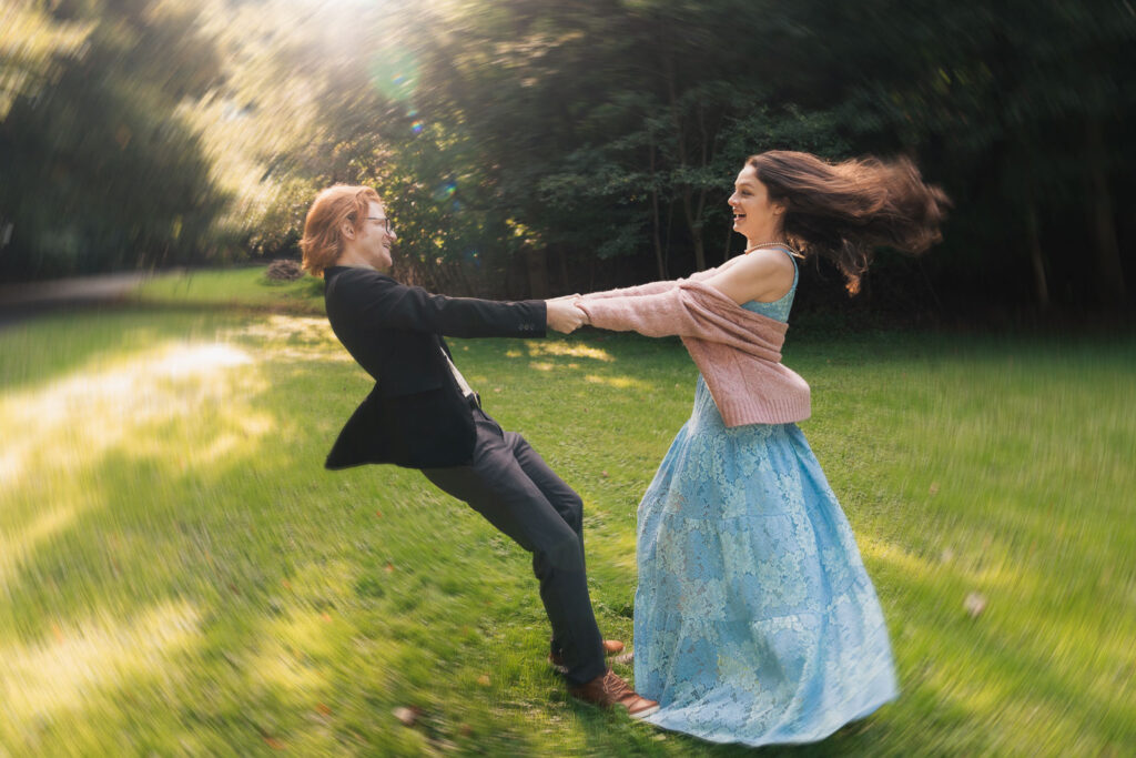 a couple taking anniversary photos in a park during summer