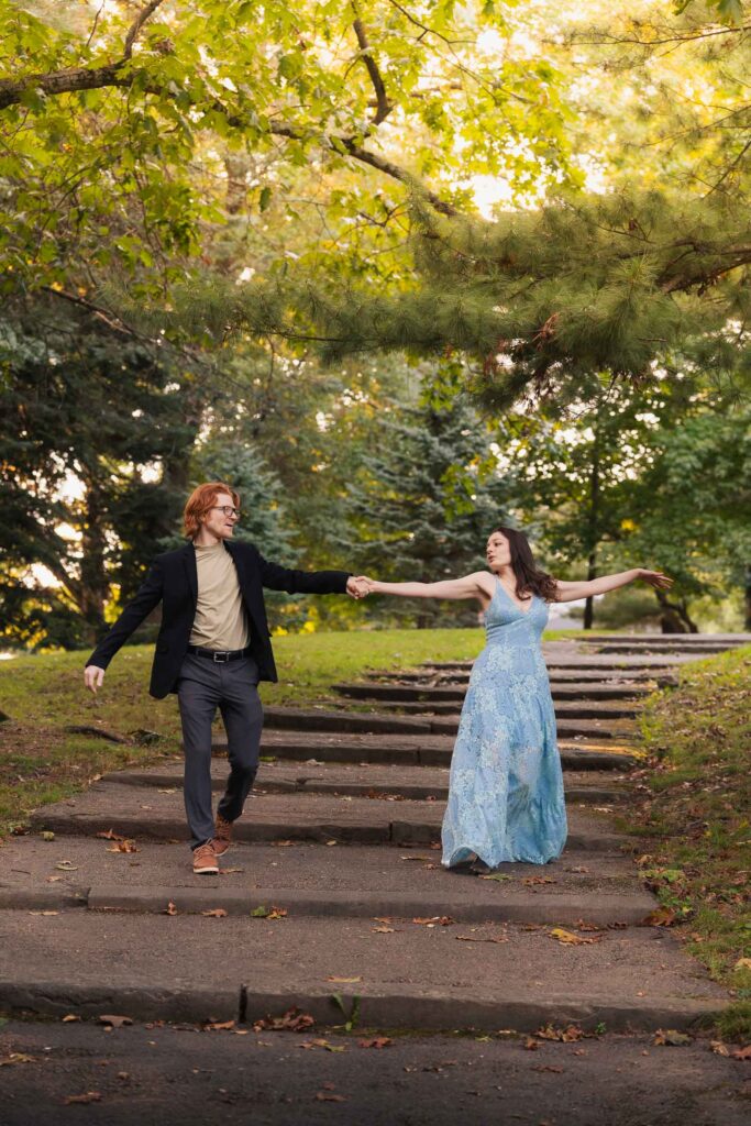 a couple taking anniversary photos in a park during summer