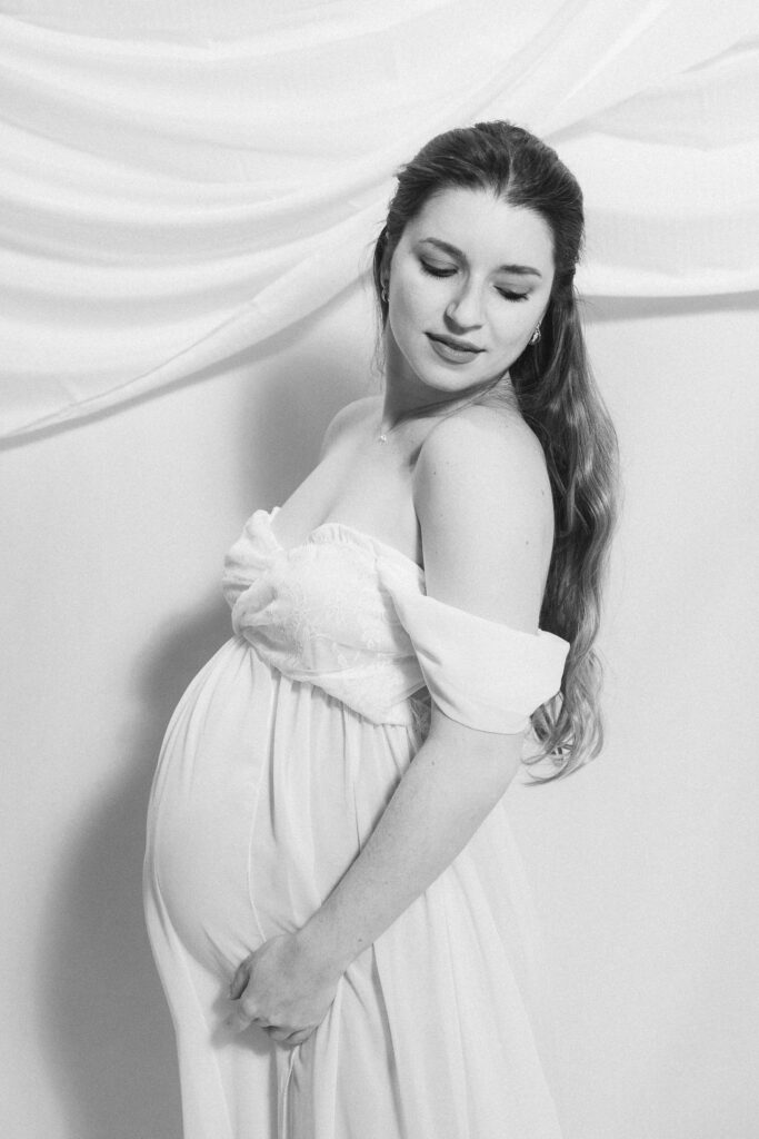 maternity photos of two ballroom dancers