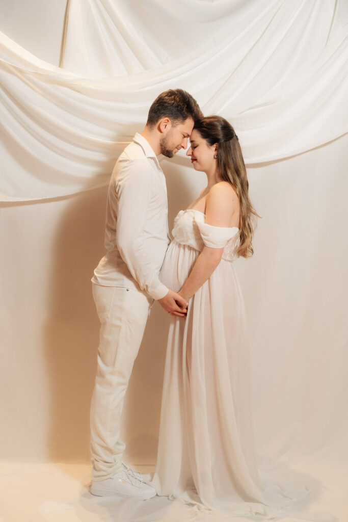 maternity photos of two ballroom dancers