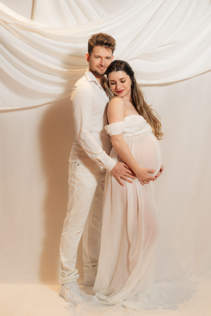 maternity photos of two ballroom dancers