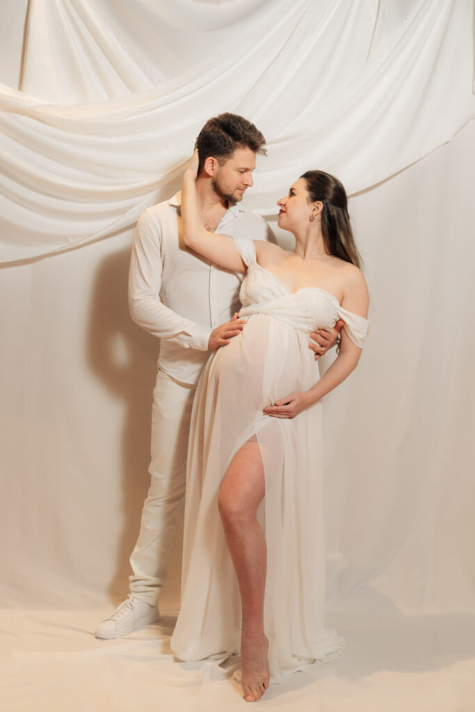 maternity photos of two ballroom dancers