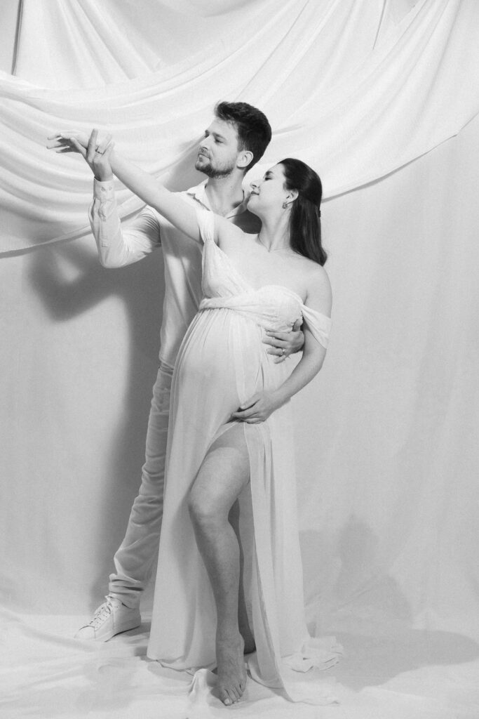 maternity photos of two ballroom dancers