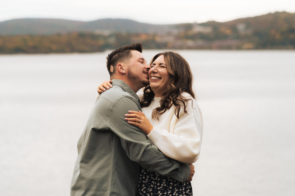 Couple hiking around cold springs new york for engagement photos in autumn