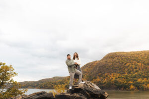Couple hiking around cold springs new york for engagement photos in autumn