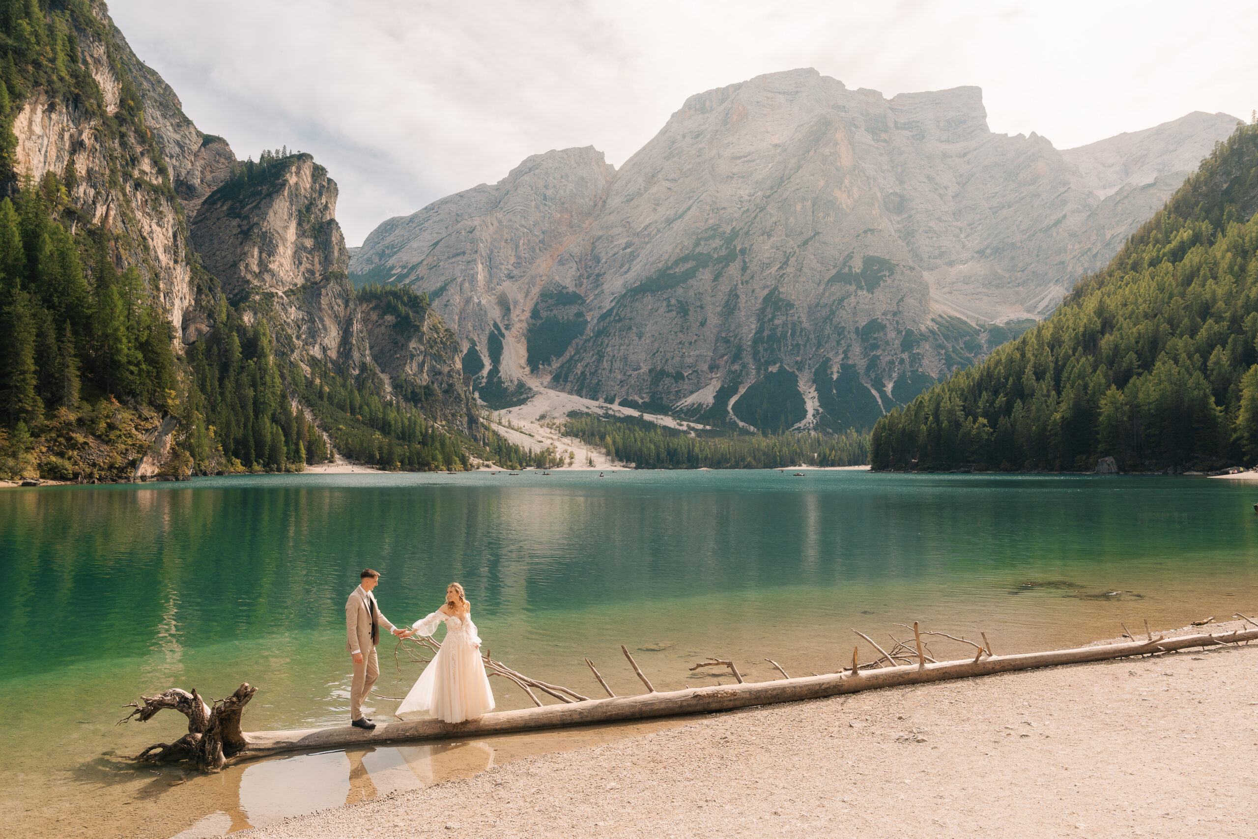 A summer elopement at the reflective lake of Lago Di Braies in the Italian Dolomites.