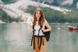 A female elopement photographer at Lago di Braies in the Italian Dolomites.
