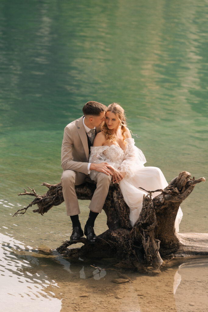 A summer elopement at the reflective lake of Lago Di Braies in the Italian Dolomites.