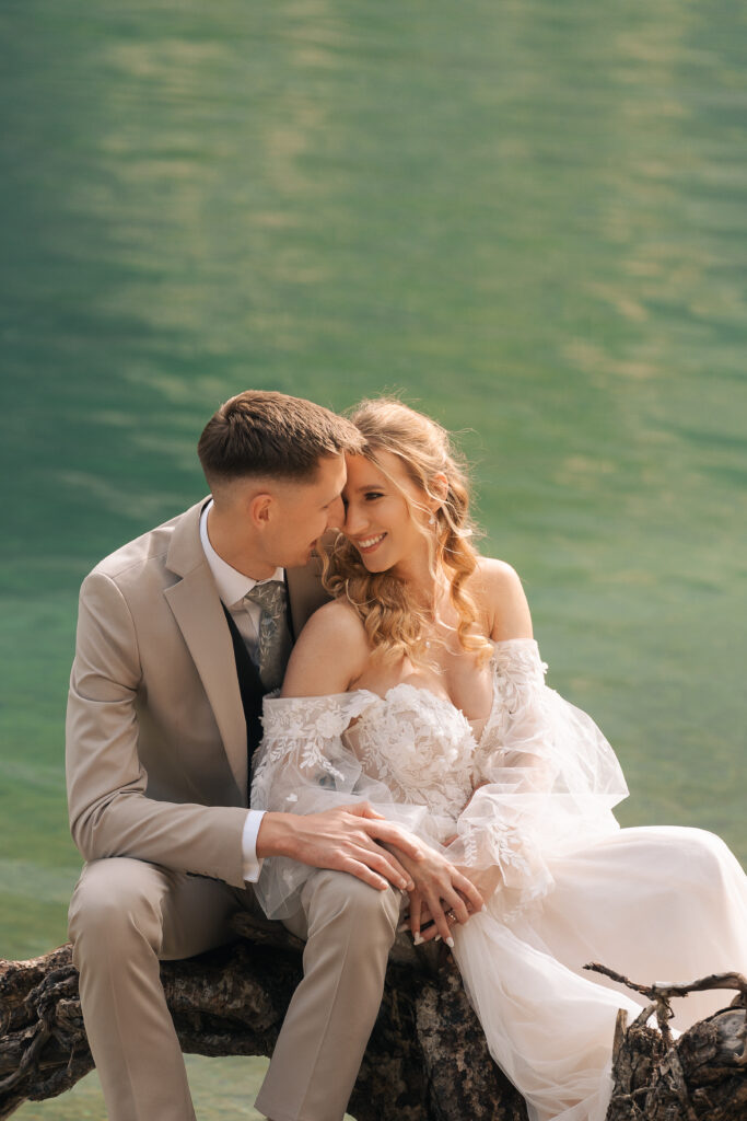 A summer elopement at the reflective lake of Lago Di Braies in the Italian Dolomites.