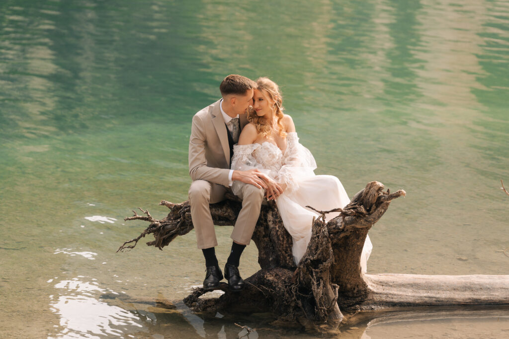 A summer elopement at the reflective lake of Lago Di Braies in the Italian Dolomites.
