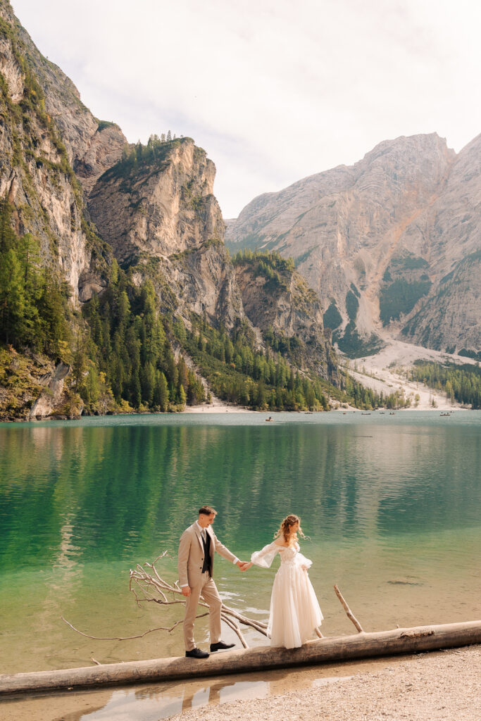 A summer elopement at the reflective lake of Lago Di Braies in the Italian Dolomites.