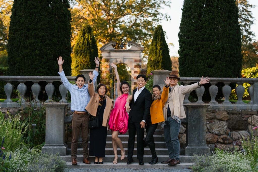 A romantic autumn proposal at Old Westbury Gardens in Old Westbury, New York, featuring a surprise family reveal, golden hour portraits, and a joyful engagement celebration