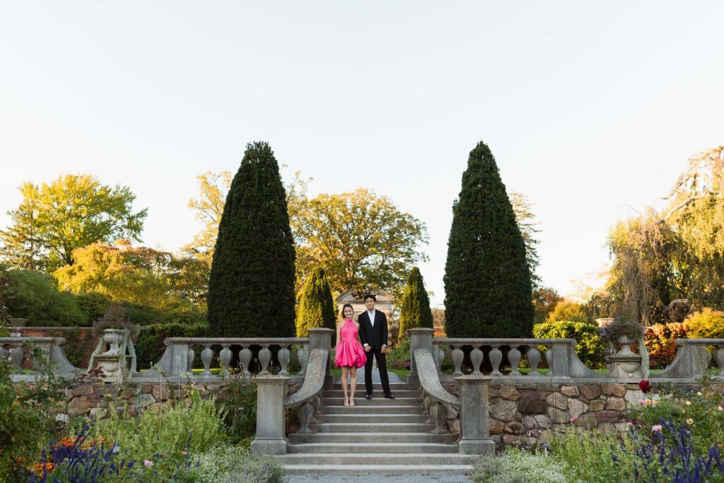 A romantic autumn proposal at Old Westbury Gardens in Old Westbury, New York, featuring a surprise family reveal, golden hour portraits, and a joyful engagement celebration