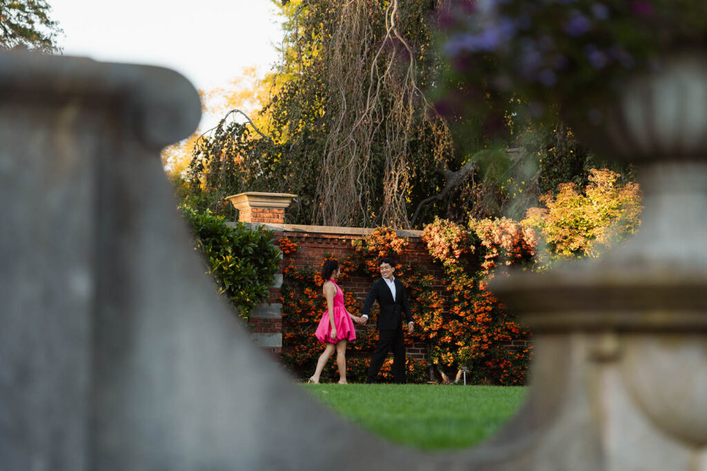 A romantic autumn proposal at Old Westbury Gardens in Old Westbury, New York, featuring a surprise family reveal, golden hour portraits, and a joyful engagement celebration