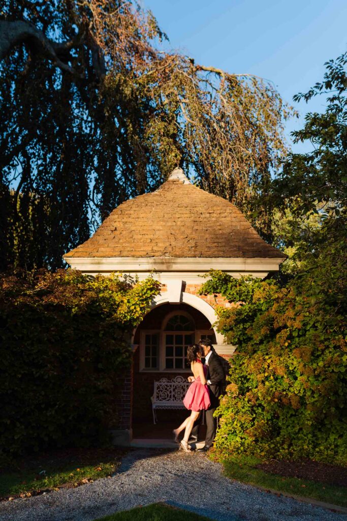 A romantic autumn proposal at Old Westbury Gardens in Old Westbury, New York, featuring a surprise family reveal, golden hour portraits, and a joyful engagement celebration