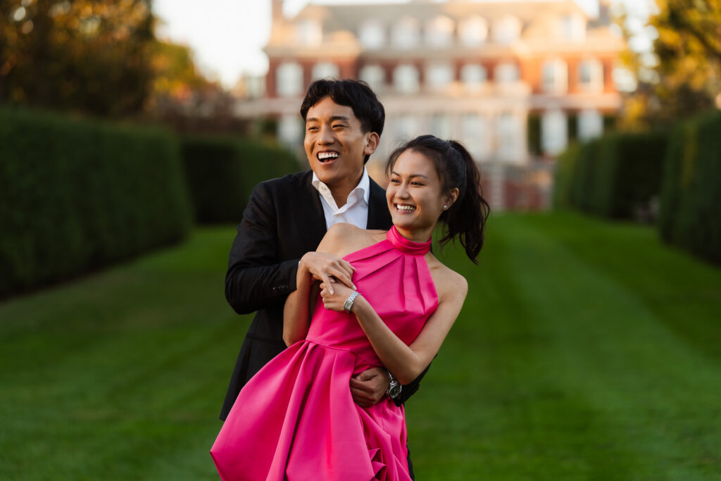 A romantic autumn proposal at Old Westbury Gardens in Old Westbury, New York, featuring a surprise family reveal, golden hour portraits, and a joyful engagement celebration