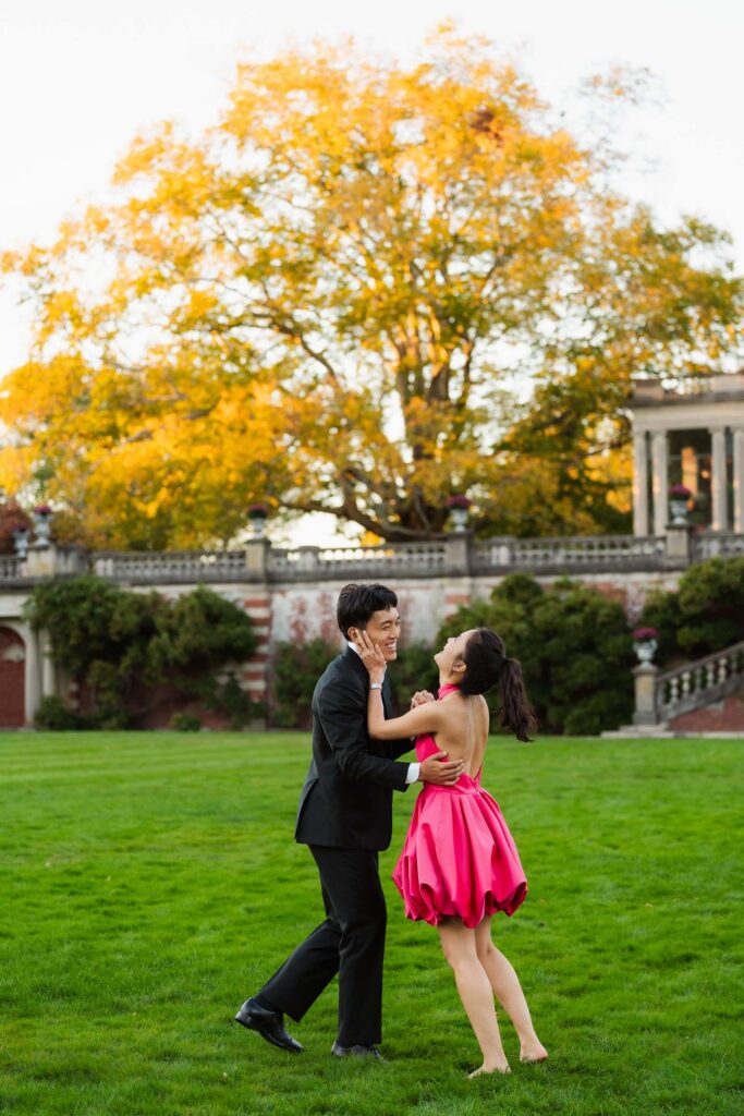 A romantic autumn proposal at Old Westbury Gardens in Old Westbury, New York, featuring a surprise family reveal, golden hour portraits, and a joyful engagement celebration