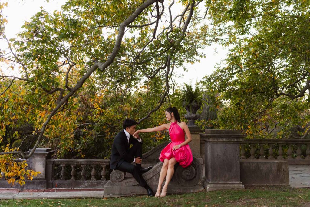 A romantic autumn proposal at Old Westbury Gardens in Old Westbury, New York, featuring a surprise family reveal, golden hour portraits, and a joyful engagement celebration