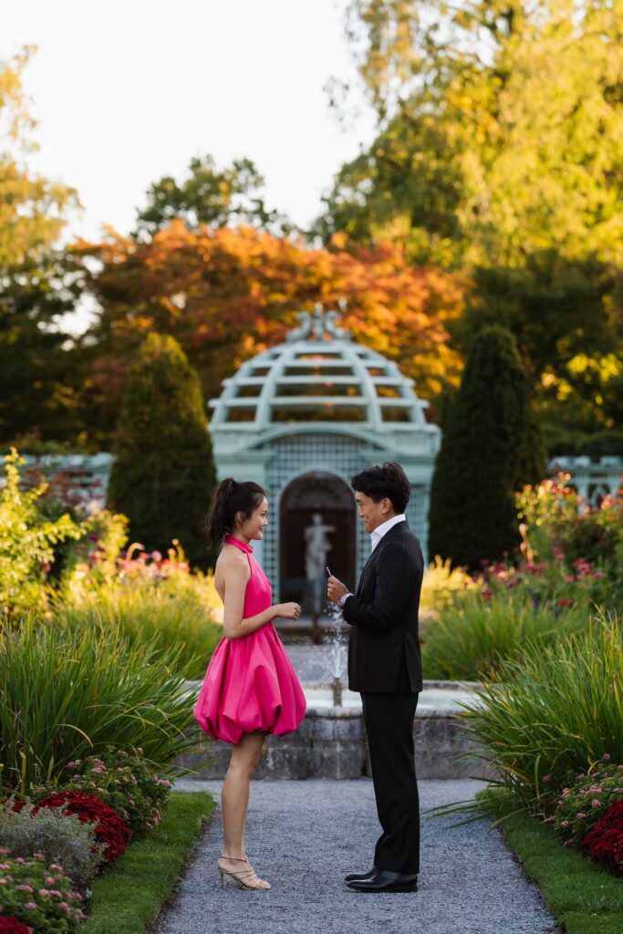 A romantic autumn proposal at Old Westbury Gardens in Old Westbury, New York, featuring a surprise family reveal, golden hour portraits, and a joyful engagement celebration