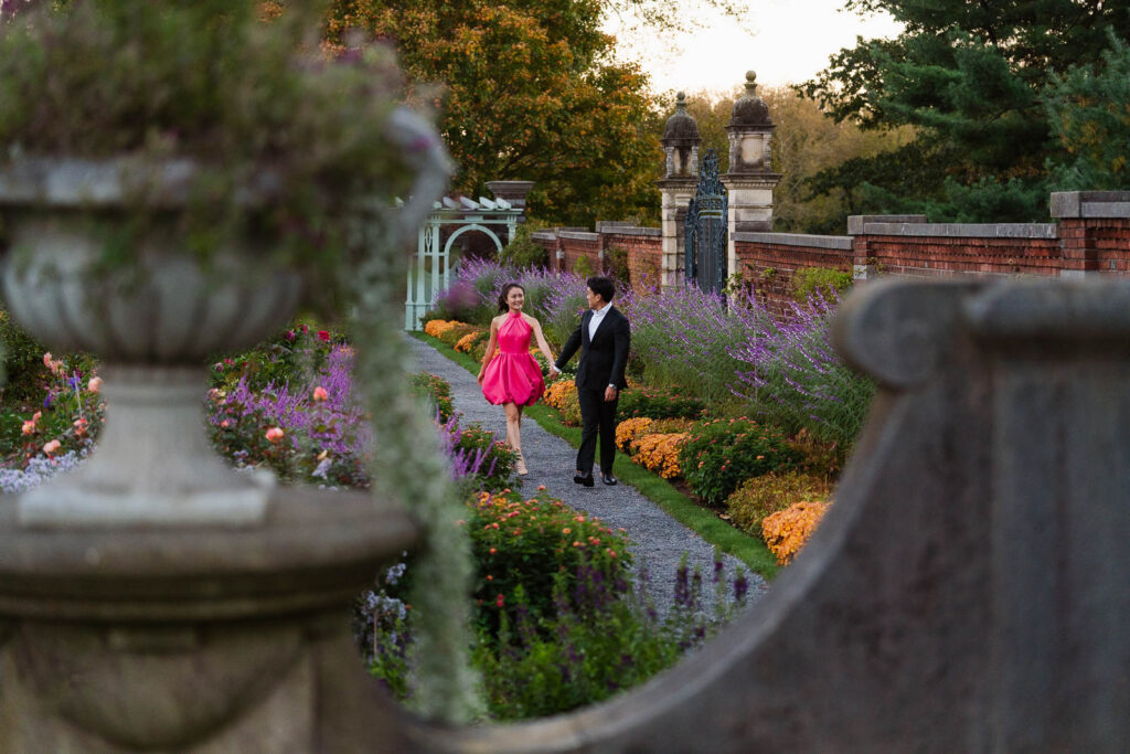 A romantic autumn proposal at Old Westbury Gardens in Old Westbury, New York, featuring a surprise family reveal, golden hour portraits, and a joyful engagement celebration