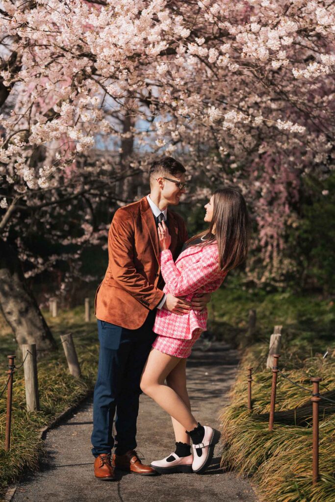 A proposal during cherry blossom season at Brooklyn Botanic Gardens.