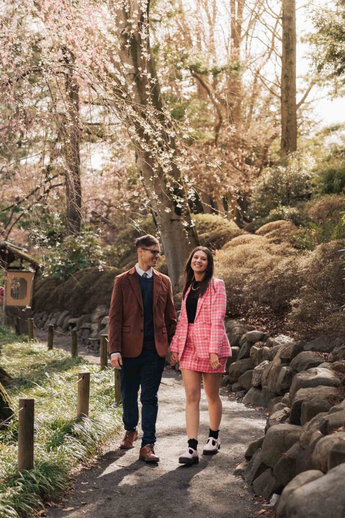 A proposal during cherry blossom season at Brooklyn Botanic Gardens.