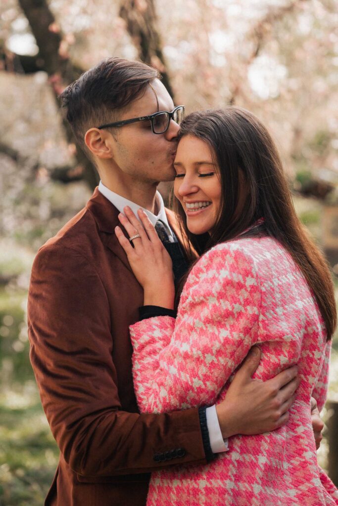 A proposal during cherry blossom season at Brooklyn Botanic Gardens.