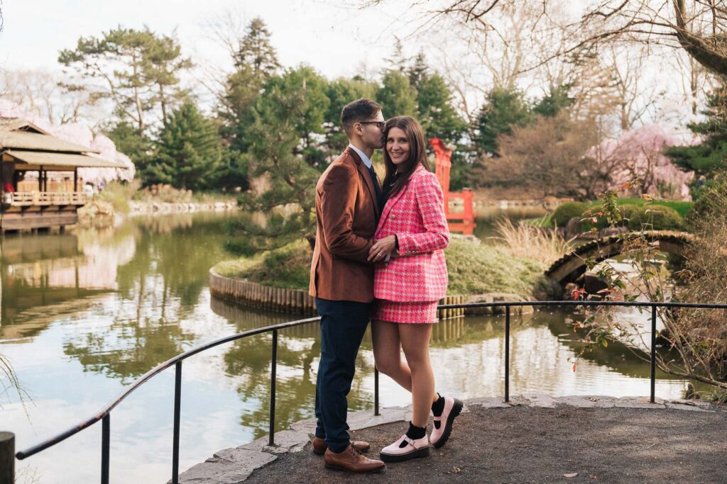 A proposal during cherry blossom season at Brooklyn Botanic Gardens.