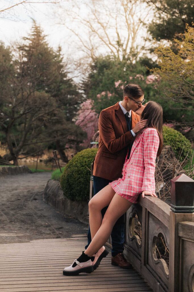 A proposal during cherry blossom season at Brooklyn Botanic Gardens.