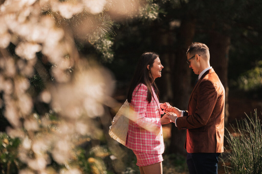 A proposal during cherry blossom season at Brooklyn Botanic Gardens.