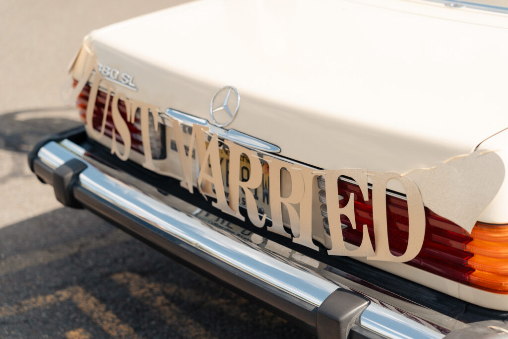 Romantic wedding portraits of bride and groom with vintage car in Franklin Lakes, New Jersey.
