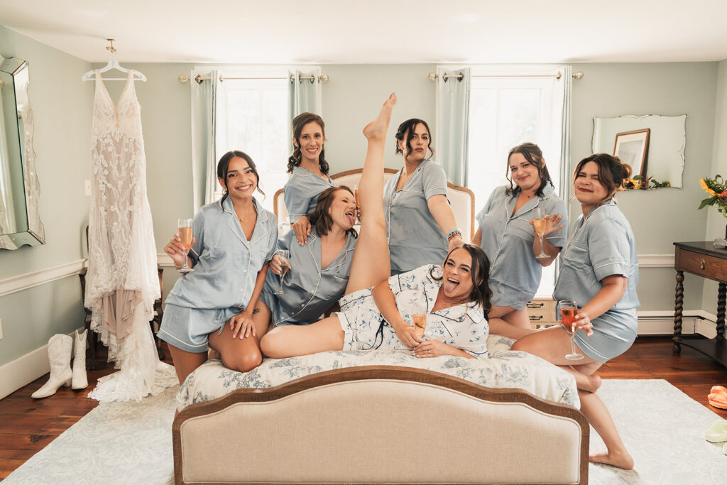 A bride and her friends having fun on her wedding morning.