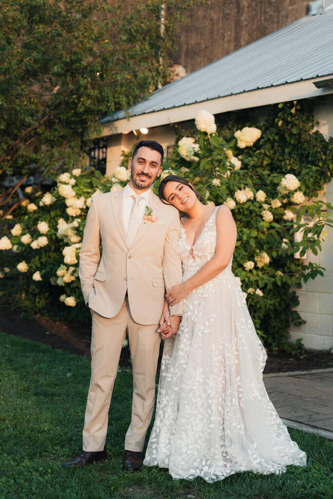 A bride and groom during sunset on their wedding day.