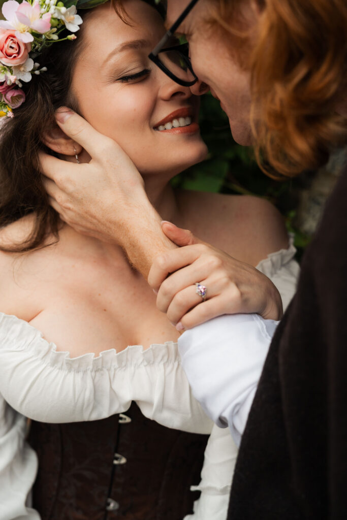 A Renaissance-inspired autumn engagement session at Skylands Manor and the New Jersey Botanical Gardens in Ringwood, NJ, featuring flower crowns, a wool cape, and romantic garden portraits before a Stone House wedding.