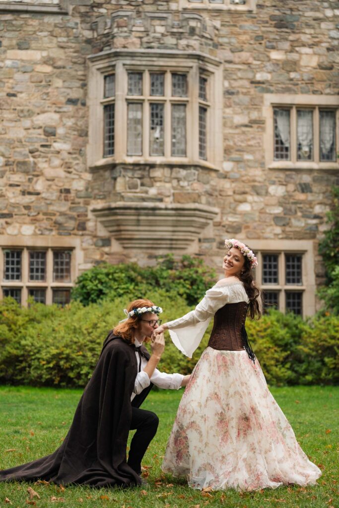 A Renaissance-inspired autumn engagement session at Skylands Manor and the New Jersey Botanical Gardens in Ringwood, NJ, featuring flower crowns, a wool cape, and romantic garden portraits before a Stone House wedding.