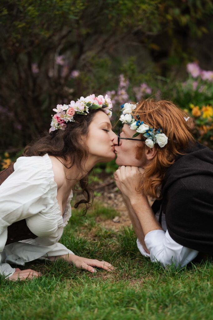 A Renaissance-inspired autumn engagement session at Skylands Manor and the New Jersey Botanical Gardens in Ringwood, NJ, featuring flower crowns, a wool cape, and romantic garden portraits before a Stone House wedding.